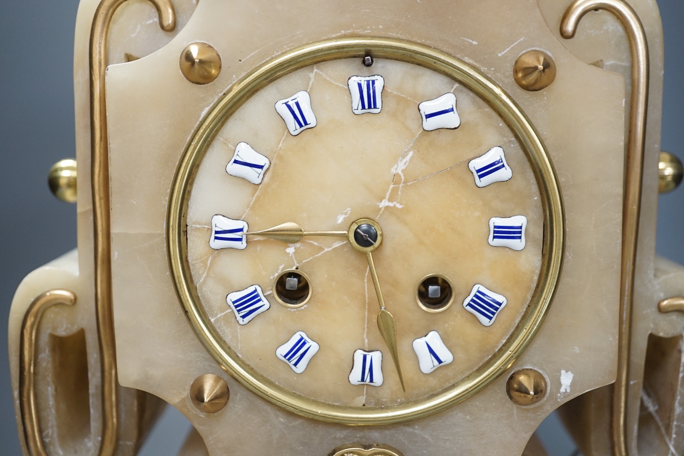 A French Art-Deco style alabaster mantel clock, 39cm tall